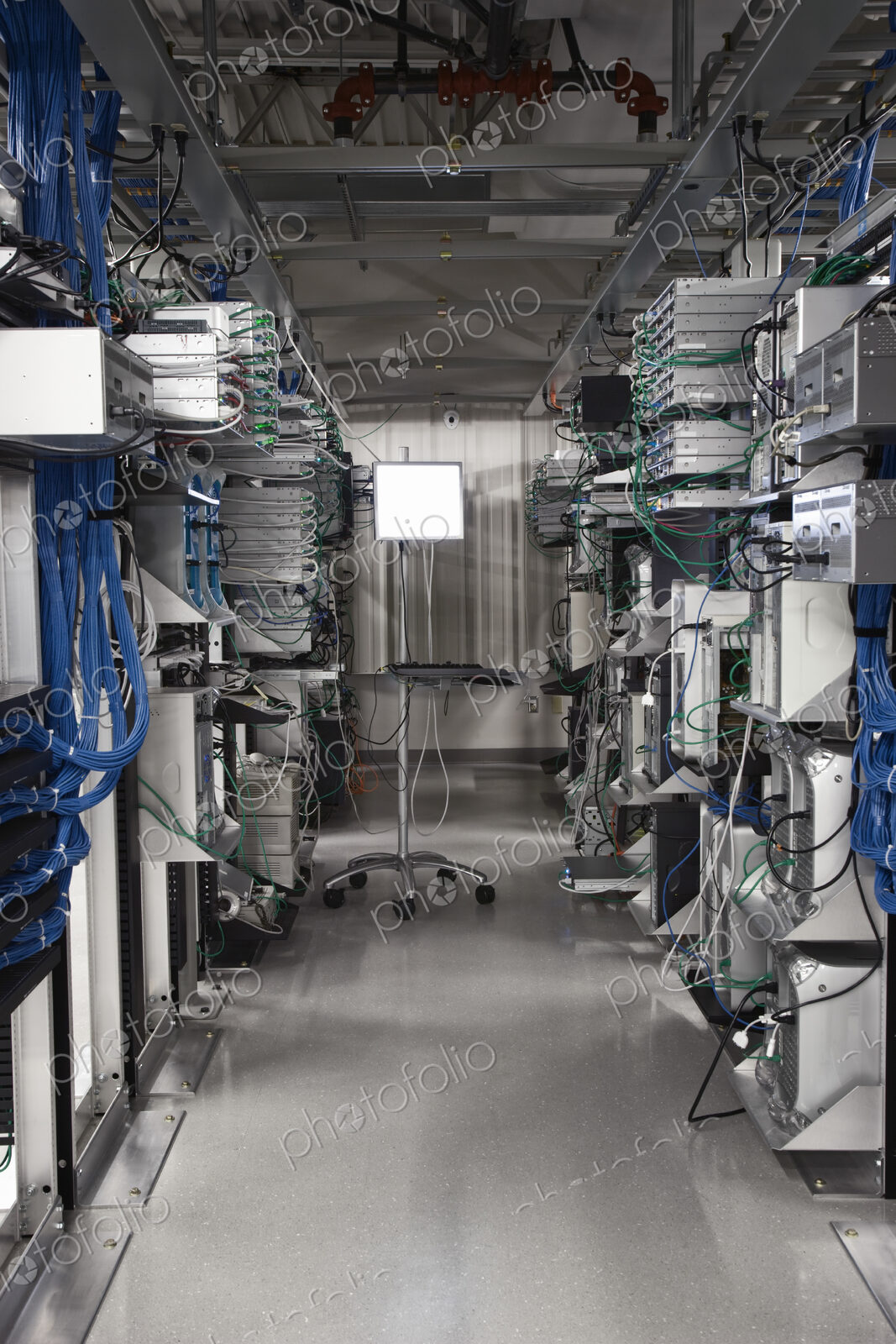 Computer server towers in racks in a computer server farm.