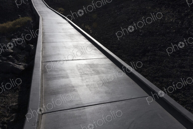 Concrete walkway extends through lava field, Craters of the Moon National Monument.