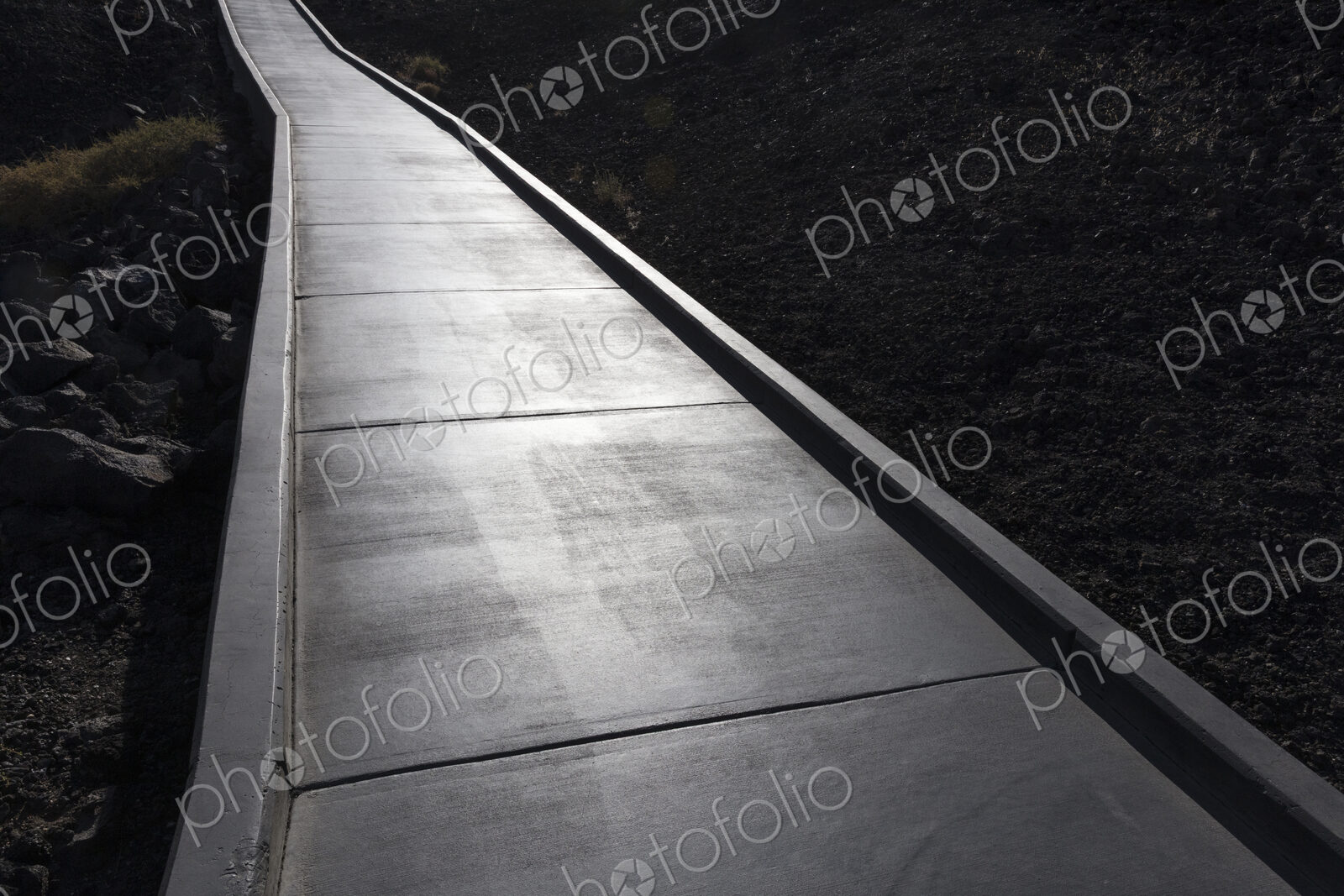 Concrete walkway extends through lava field, Craters of the Moon National Monument.