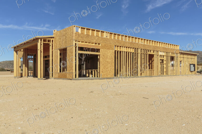Construction of house under blue sky