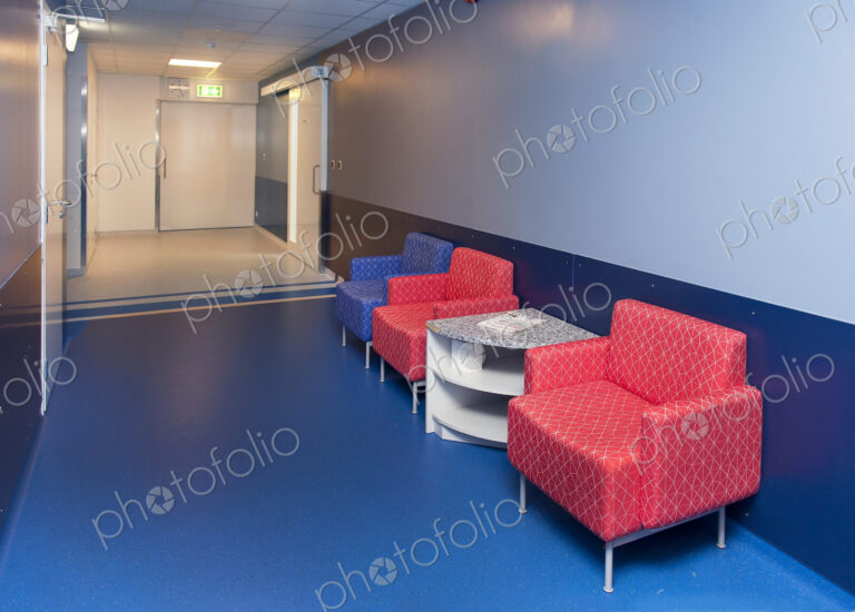Corridor and waiting areas of a modern hospital with seating