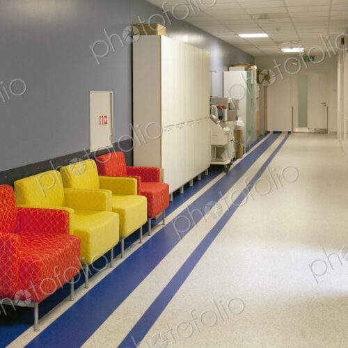 Corridor and waiting areas of a modern hospital with seating Corridor and waiting areas of a modern hospital with seating