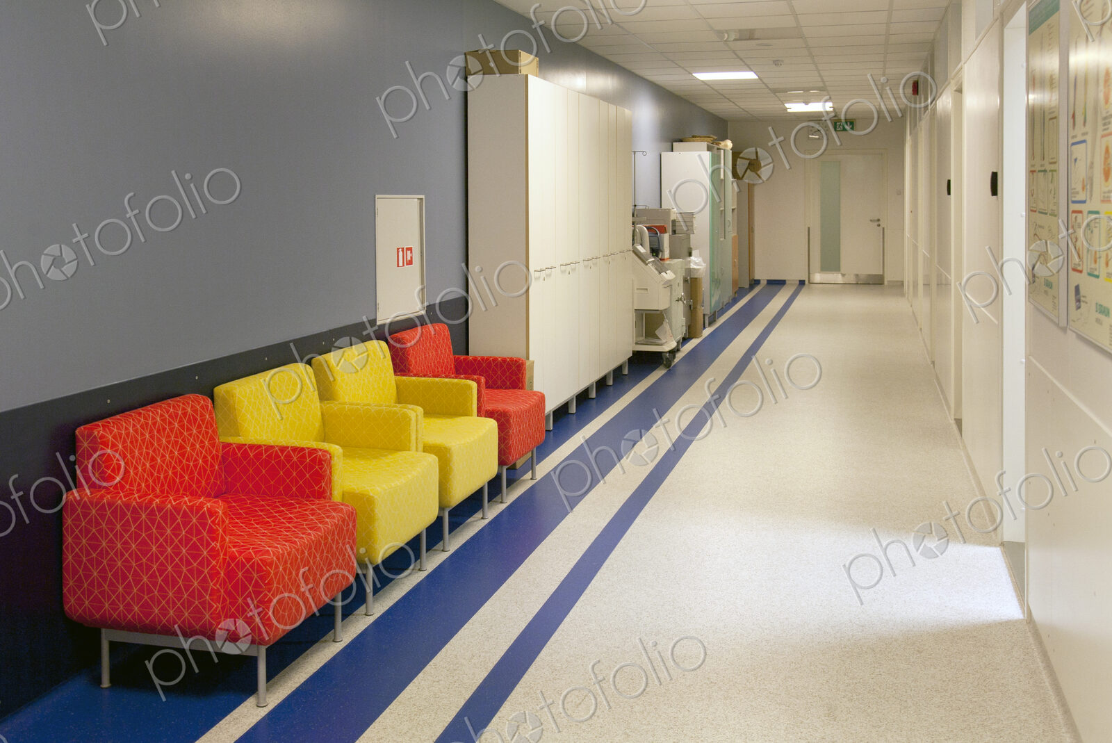 Corridor and waiting areas of a modern hospital with seating