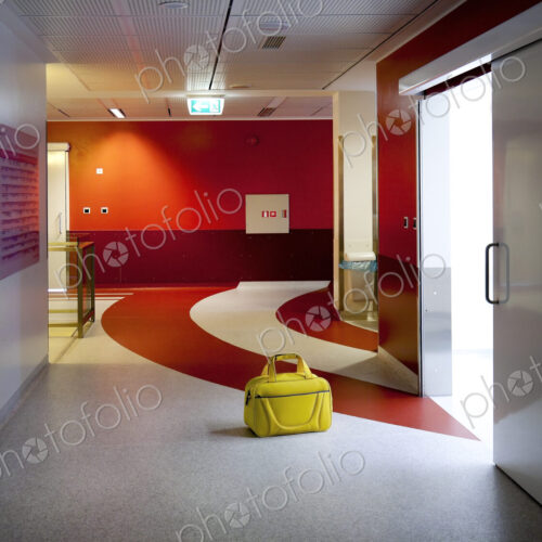Corridor and waiting areas of a modern hospital with seating Corridor and waiting areas of a modern hospital with seating