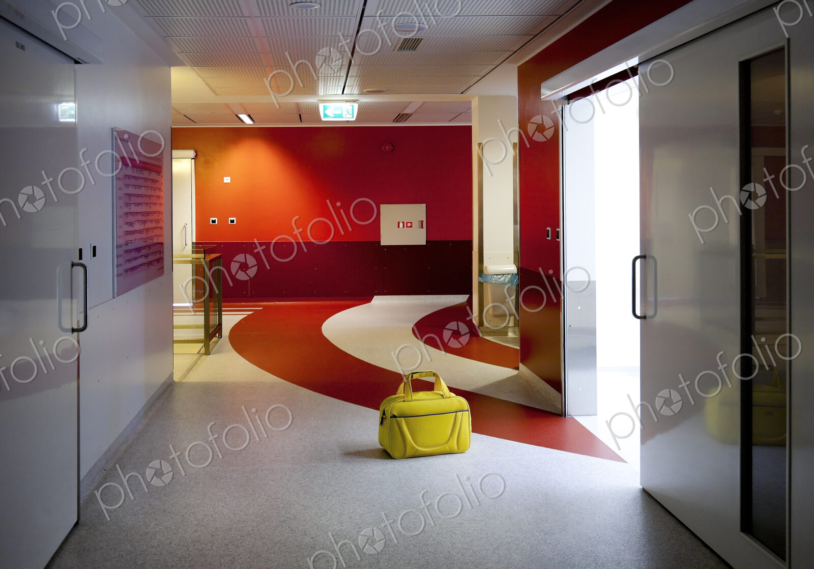Corridor and waiting areas of a modern hospital with seating