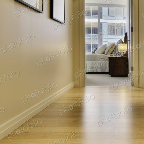 Corridor leading to bedroom in luxury highrise apartment