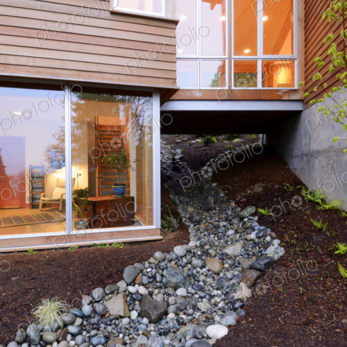 Corridor of modern house built over rocky creek Corridor of modern house built over rocky creek