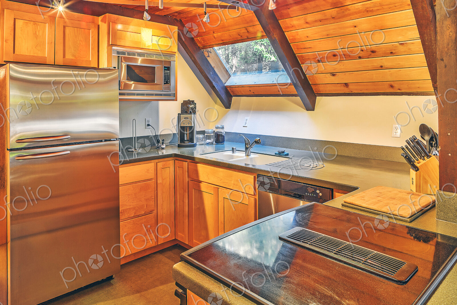 Countertops and refrigerator in rustic kitchen