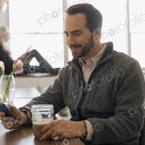 Couple Relaxing at Home with Laptop and E-Reader Couple Relaxing at Home with Laptop and E-Reader