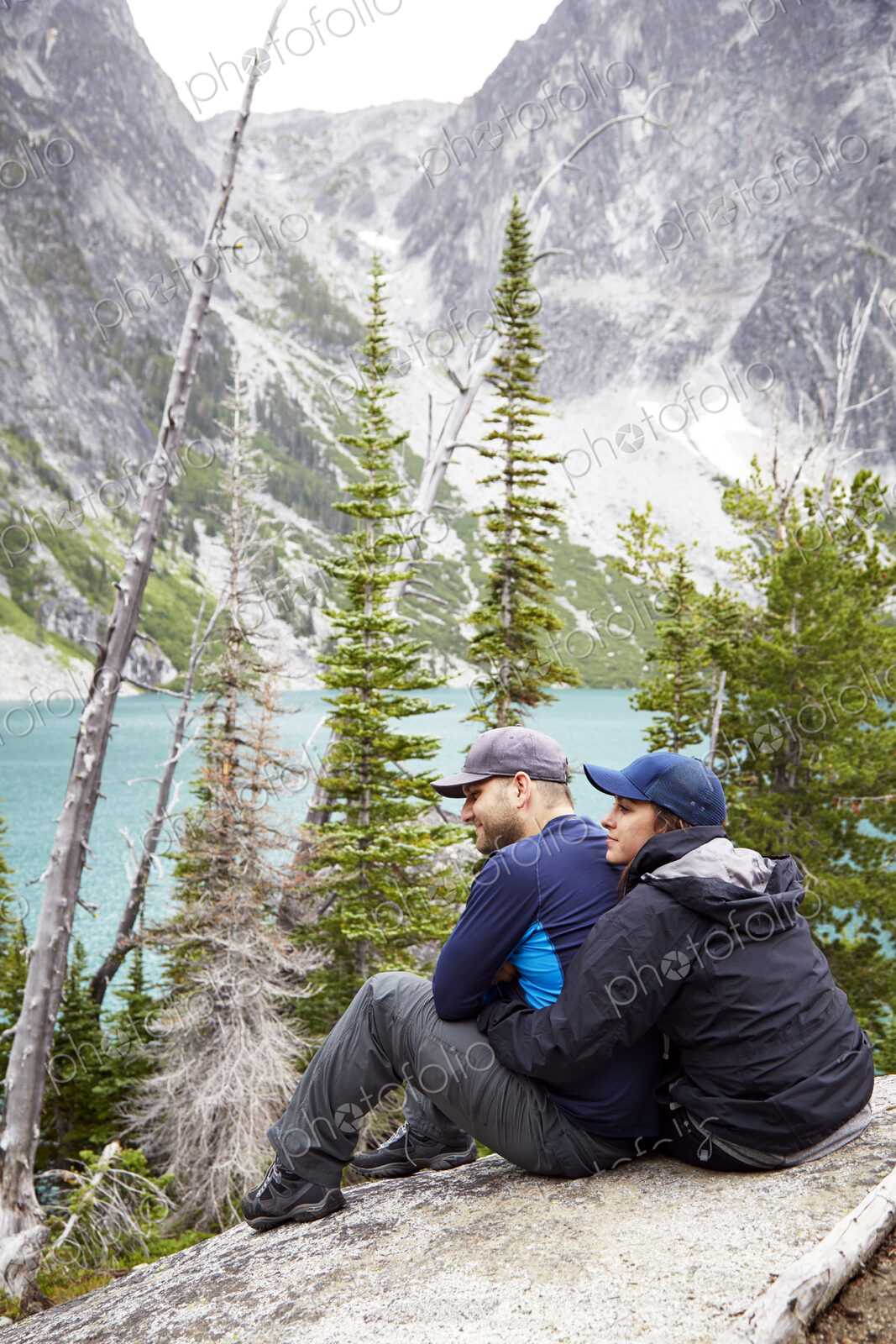 Couple admiring mountains and remote lake