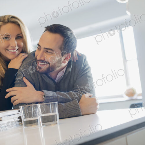 Couple at home in modern kitchen Couple at home in modern kitchen