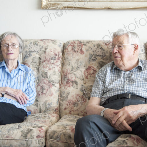 Couple sitting on sofa