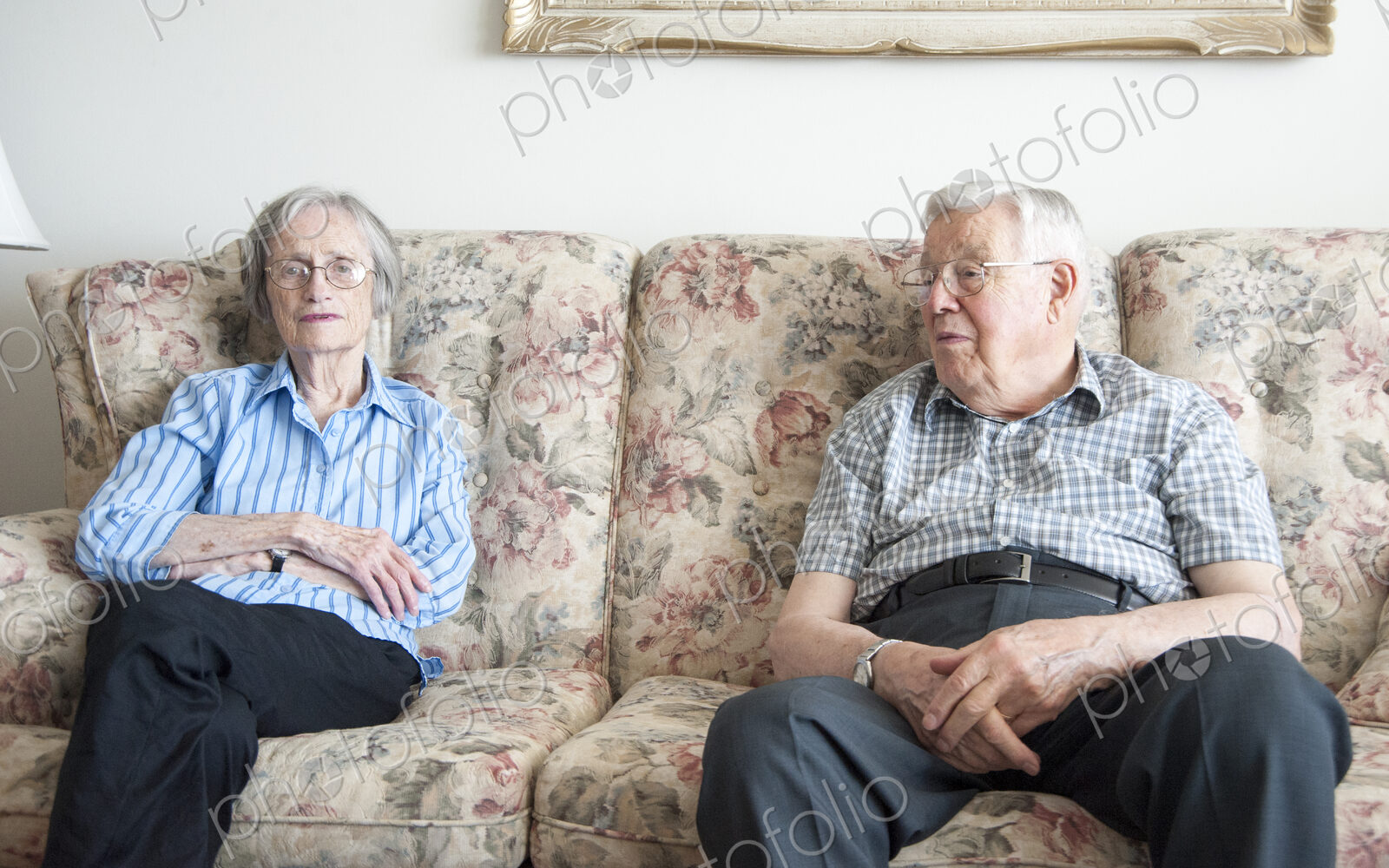 Couple sitting on sofa