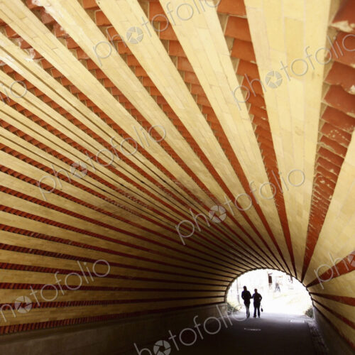 Couple walking through a tunnel in New York. Couple walking through a tunnel in New York.