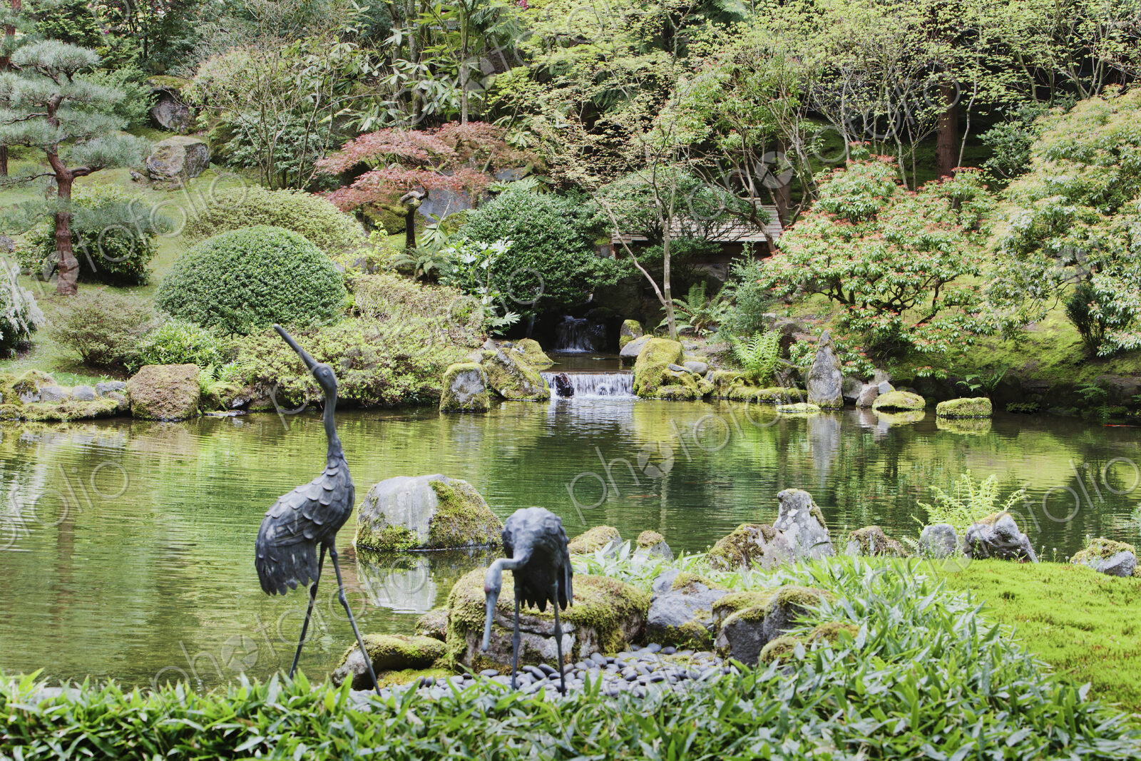 Crane statues at pond in Japanese Garden, Portland, Oregon, United States