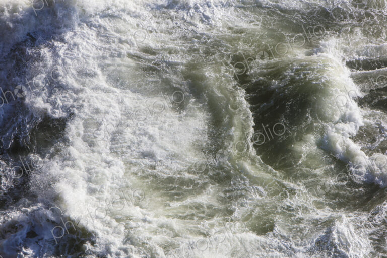 Crashing waves and ocean surf from above