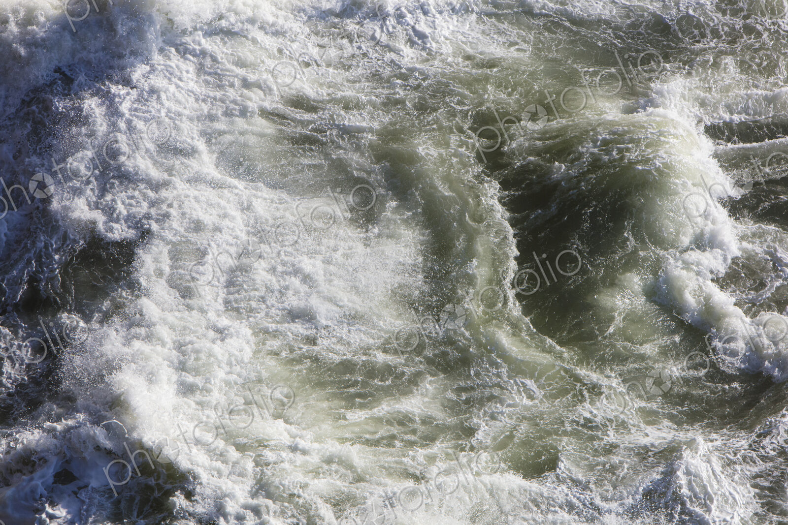 Crashing waves and ocean surf from above