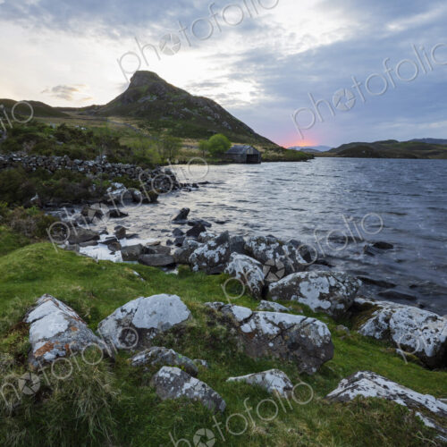 Cregennen Lakes at sunrise, a cloudy sky, the shoreline of the lake. Cregennen Lakes at sunrise, a cloudy sky, the shoreline of the lake.