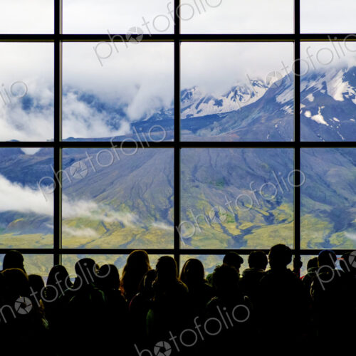 Crowd at window with scenic view of mountain Crowd at window with scenic view of mountain