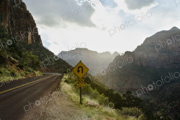 Curve Ahead Sign in Mountain Pass