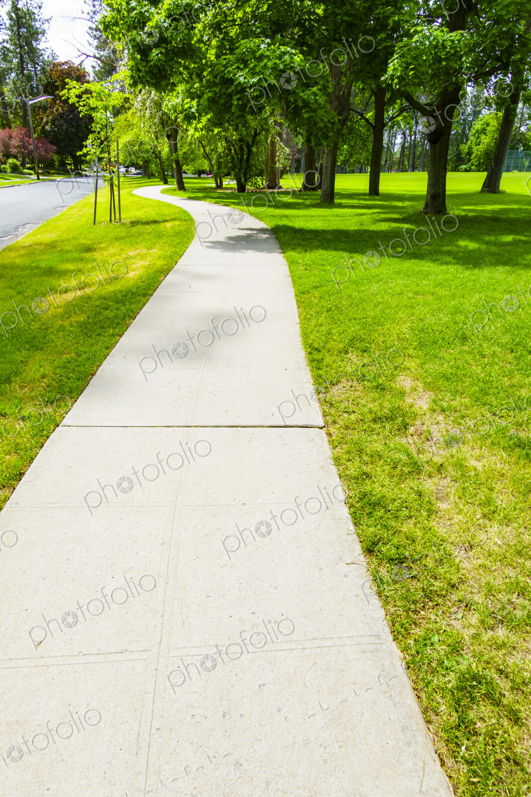 Curvy sidewalk by park, Spokane, WA USA