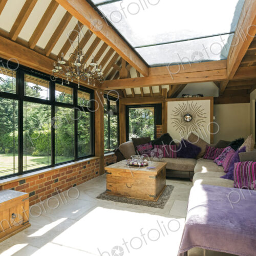 Cushioned benches in sunny conservatory