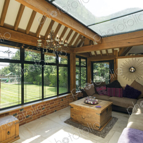 Cushioned benches in sunny conservatory