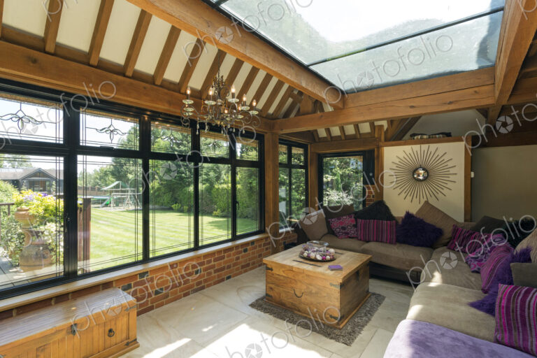 Cushioned benches in sunny conservatory
