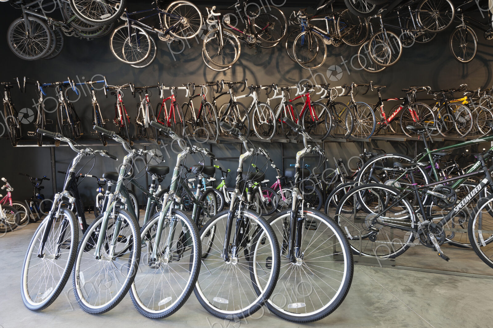 Cycle repair shop interior, rows of bicycles.
