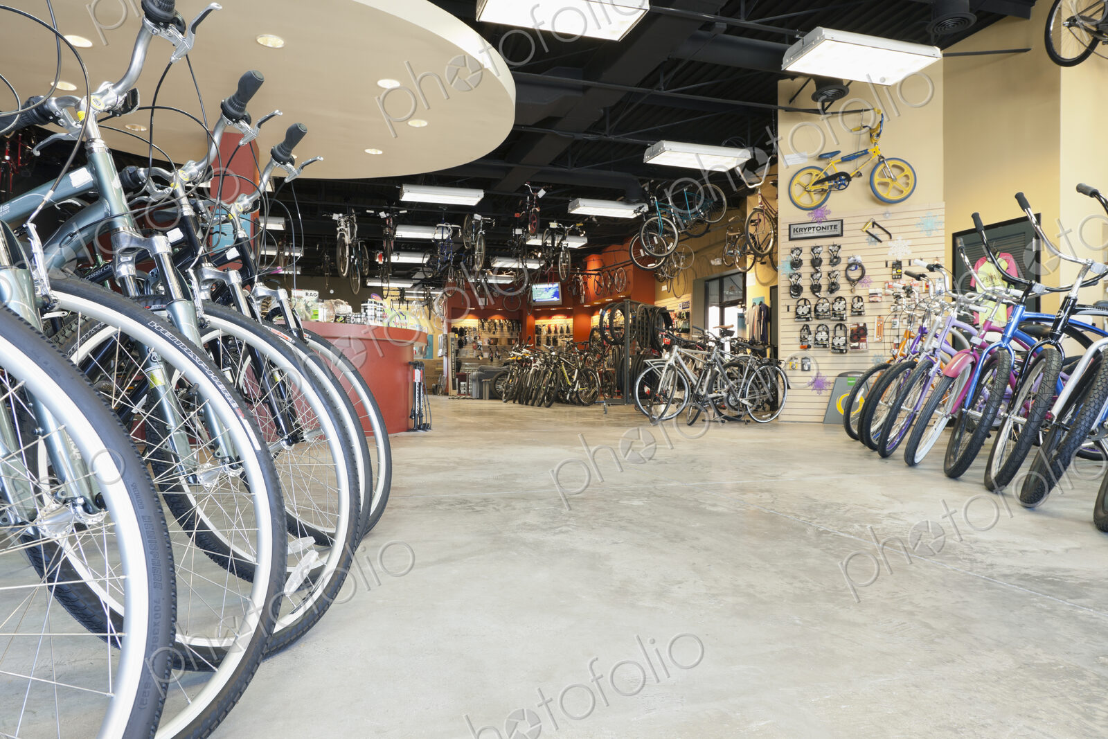 Cycle repair shop interior, rows of bicycles.