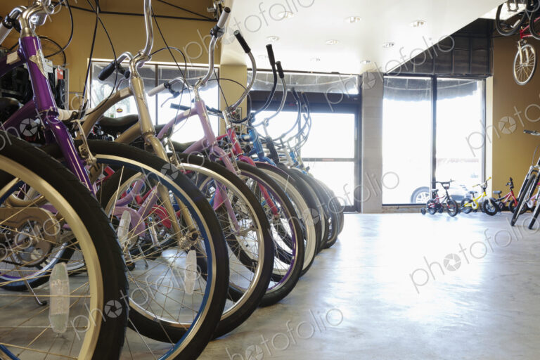 Cycle repair shop interior, rows of bicycles.