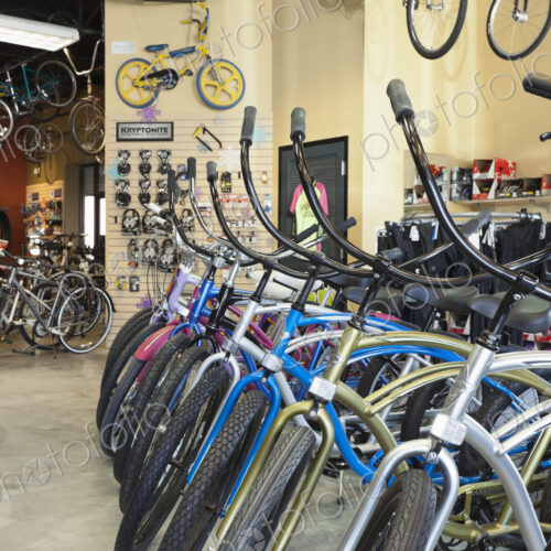 Cycle repair shop interior, rows of bicycles.