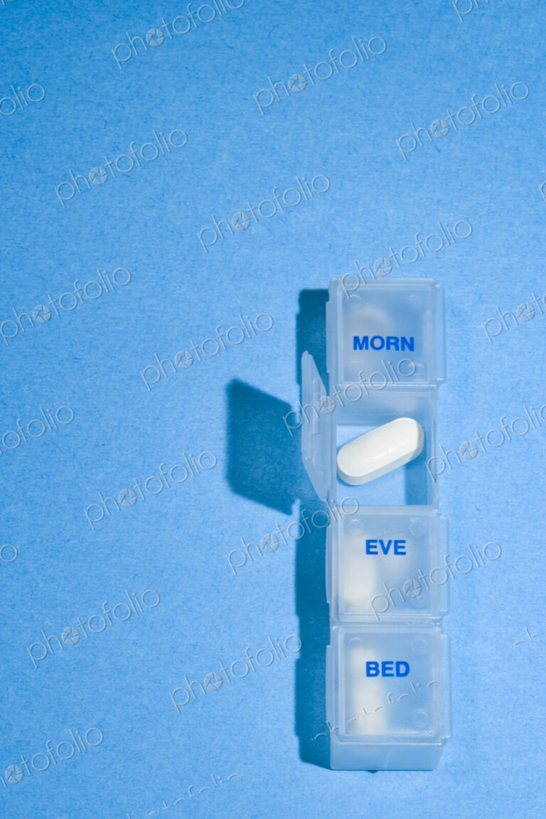 Daily Pill Container, four compartments with a one case open.