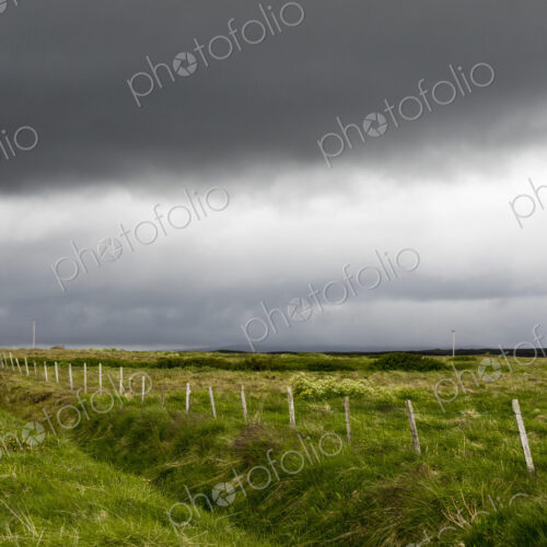 Dark rain clouds over farmland. Dark rain clouds over farmland.