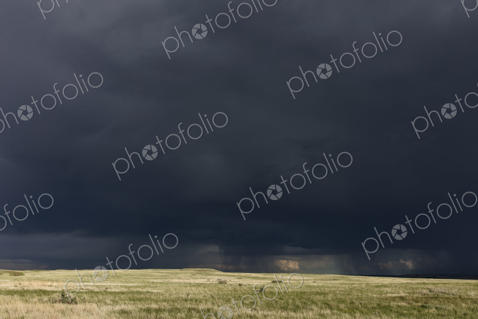 Dark storm clouds of over Grasslands National Park, Saskatchewan, Canada.