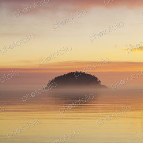 Deception Island, offshore on the coastline of Deception Pass State Park, a silhouette… Deception Island, offshore on the coastline of Deception Pass State Park, a silhouette…