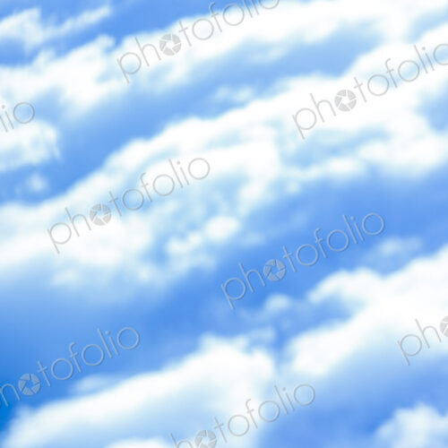 Defocussed view of fluffy clouds in a blue sky. Defocussed view of fluffy clouds in a blue sky.