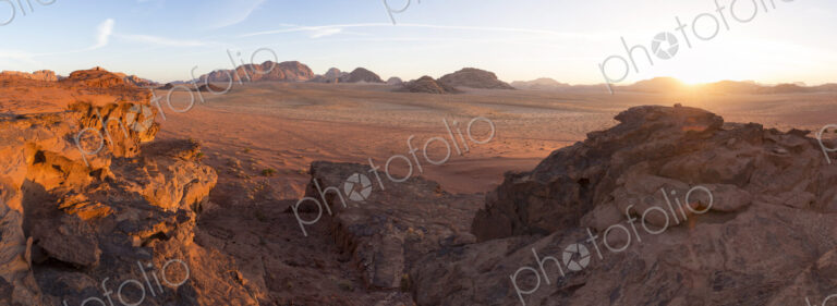Desert landscape with rocks at sunset.