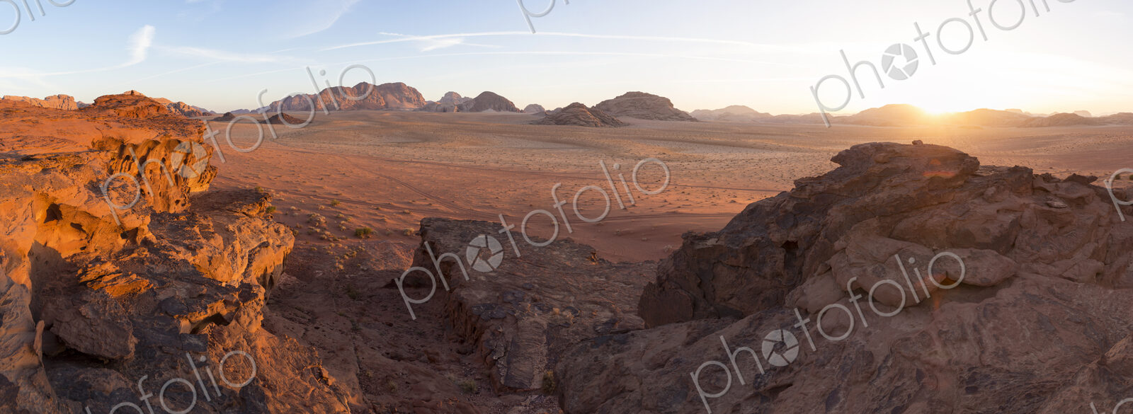 Desert landscape with rocks at sunset.