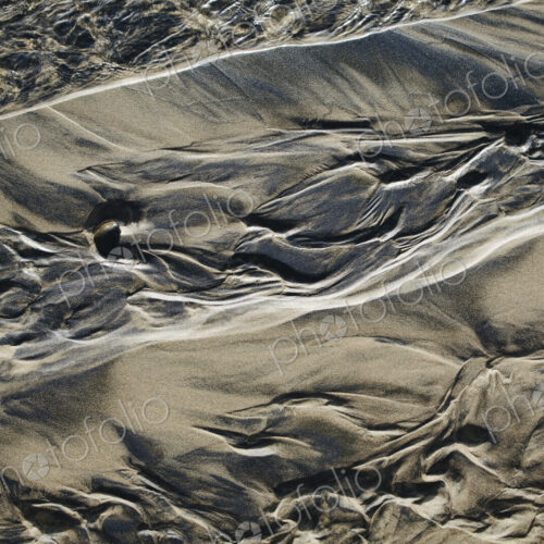Detail of beach sand and patterns at low tide, Arcadia Beach State Park, Oregon Detail of beach sand and patterns at low tide, Arcadia Beach State Park, Oregon