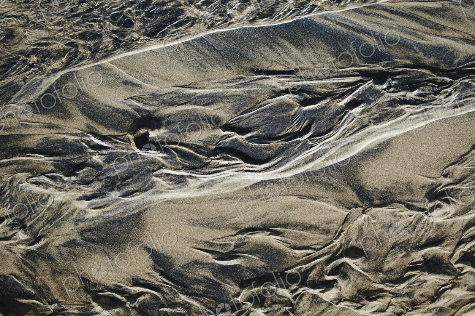 Detail of beach sand and patterns at low tide, Arcadia Beach State Park, Oregon