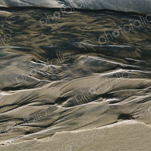 Detail of beach sand and patterns at low tide, Arcadia Beach State Park, Oregon Detail of beach sand and patterns at low tide, Arcadia Beach State Park, Oregon