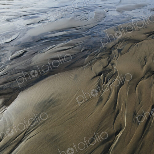 Detail of beach sand and patterns at low tide, Arcadia Beach State Park, Oregon Detail of beach sand and patterns at low tide, Arcadia Beach State Park, Oregon