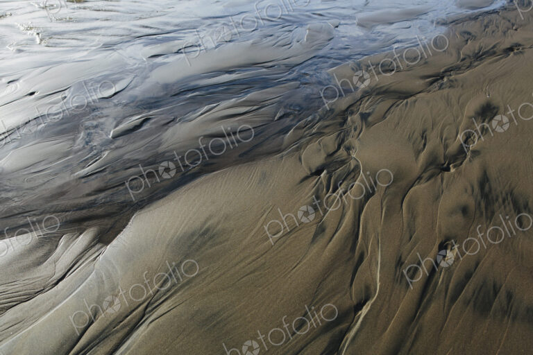 Detail of beach sand and patterns at low tide, Arcadia Beach State Park, Oregon