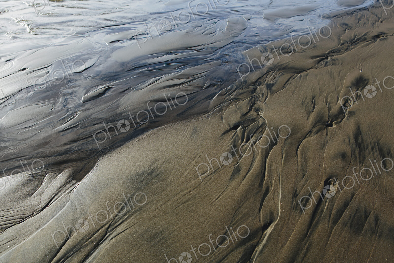 Detail of beach sand and patterns at low tide, Arcadia Beach State Park, Oregon