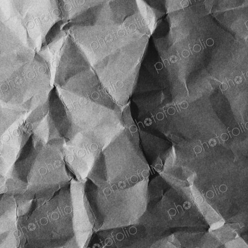 Detail of creased and wrinkled paper, close up Detail of creased and wrinkled paper, close up