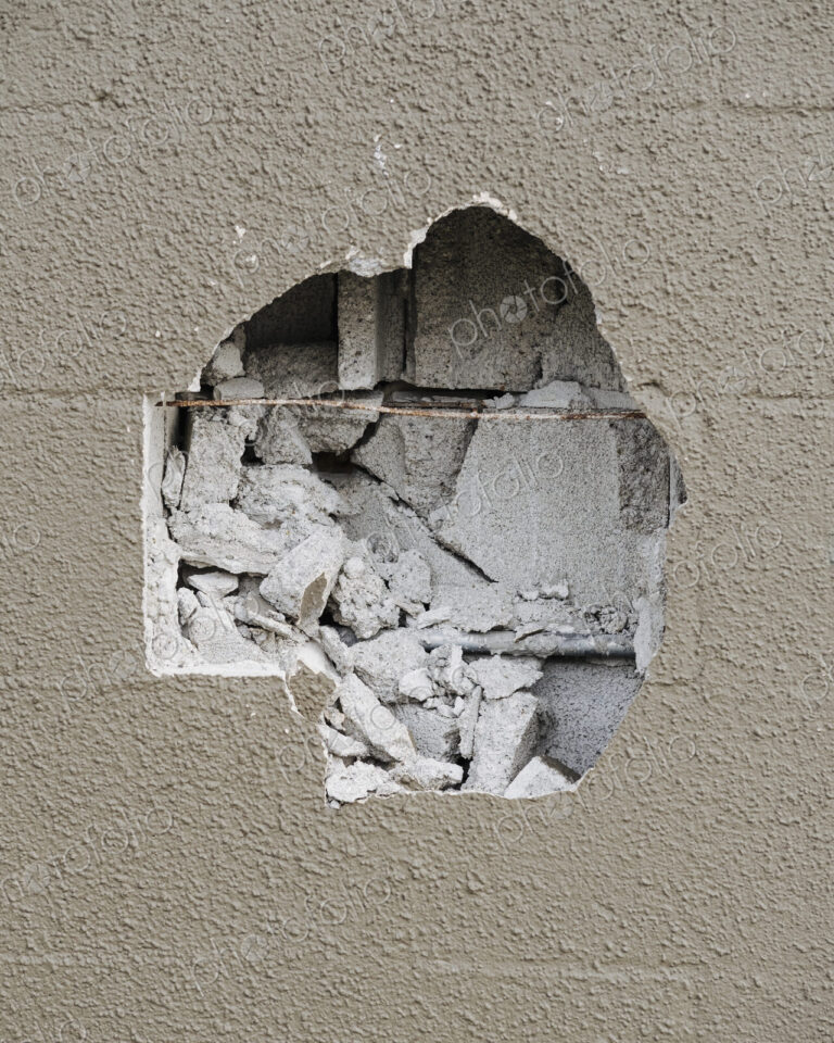 Detail of damaged concrete building wall