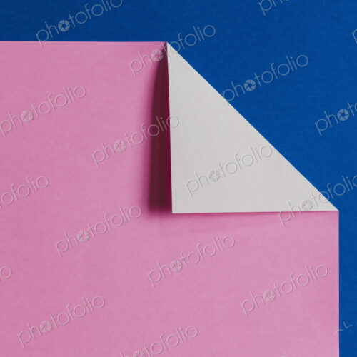 Detail of folded pink & blue origami paper Detail of folded pink & blue origami paper
