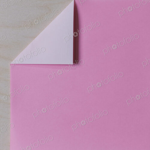 Detail of folded pink origami paper Detail of folded pink origami paper