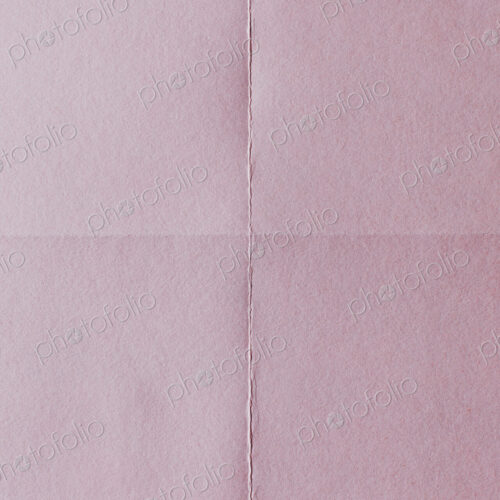 Detail of folded pink paper Detail of folded pink paper